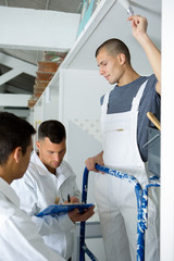 young apprentice painter in professional training