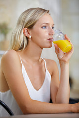 young beautiful woman drinking juice