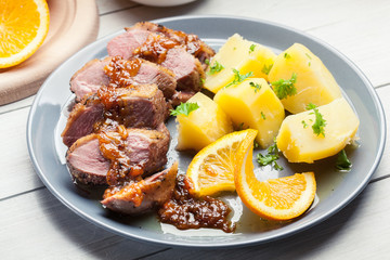 Roast duck breast with orange sauce