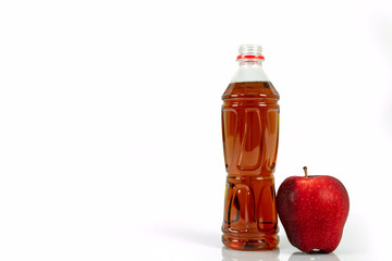 bottle of tomato juice and red apple isolated on white