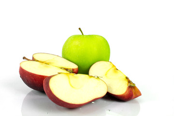 Green apple and slice of apple on white background