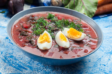 Beetroot soup served with boiled egg