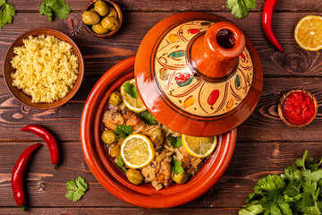 Traditional moroccan tajine of chicken with salted lemons, olives