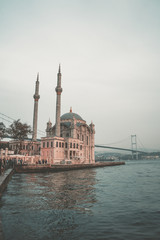 Fototapeta na wymiar Ortakoy Mosque and Istanbul Bridge, in Turkey