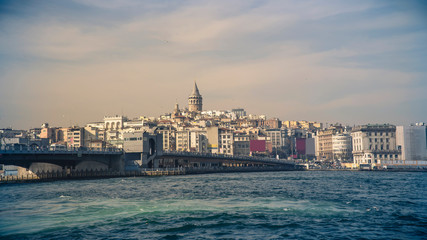Naklejka premium Galata Bridge, Karakoy district and Golden Horn with famous Galata Tower on the background, istanbul - Turkey