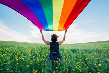 Gay Rainbow Flag on a green meadow outdoors