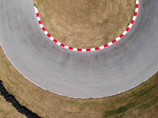 Curves on karting race track, aerial view background.