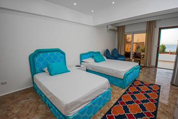 Twin beds in a luxury apartment with sea view