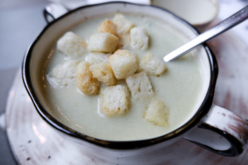 Potato cream soup with fish and crackers. Food for lunch.