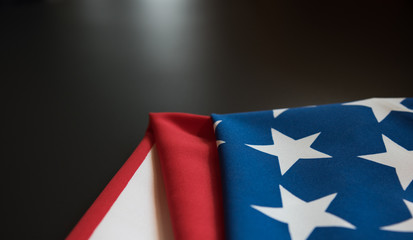 American flag close up in dark background with copy space
