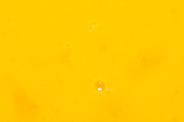 Whipped yolk with eggs as an abstract background