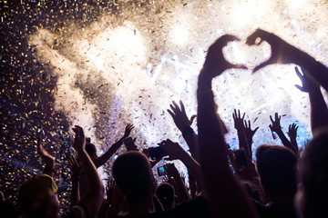 Portrait of happy crowd enjoying at music festival