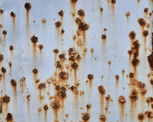  Rusty metal background with streaks of rust. The metal surface rusted spots