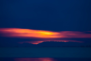 seascape of sunset sky and rain clouds