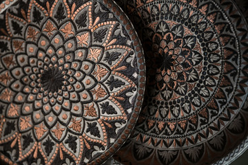 Copper plate handcrafted, traditionally made in Lagich, Azerbaijan. Handmade plate in souvenir shop.