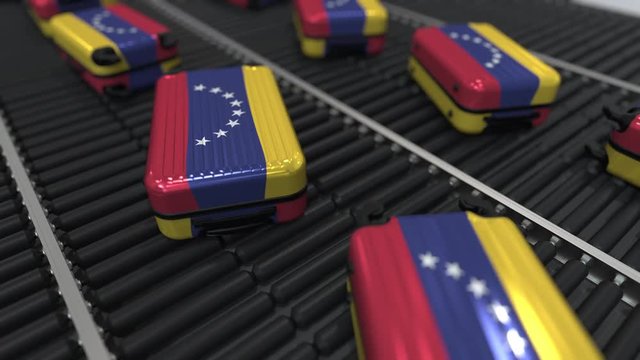Many travel suitcases featuring flag of Venezuela on roller conveyer. Venezuelan tourism conceptual animation