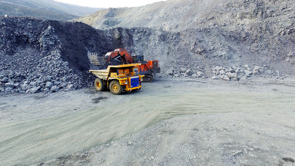 loading iron ore with an excavator
