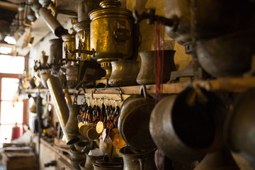 Coppersmith workshop and hand made copper things, Lahich, Azerbaijan. Interior of coppersmith workshop in the village.
