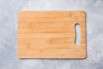 empty wooden cutting board on kitchen table. Top view copy space