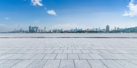Panoramic skyline and modern business office buildings with empty road,empty concrete square floor