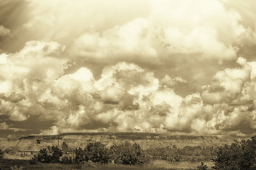 Cloudy landscape with slaghead near the mine in a working environment.