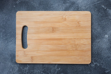empty wooden cutting board on kitchen table. Top view copy space