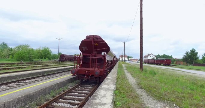Freight wagons parked on the platform with the blue sky in the background.
