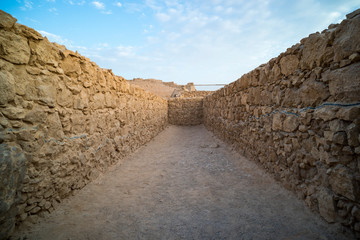 View to old stone blind alley. Architecture of ancient civilization. Masada paths and passages,...
