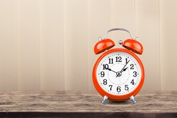 Retro old vintage alarm clock on the desk