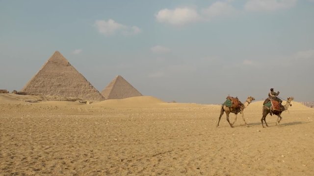 Beautiful pyramids of Egypt in Africa. A historic site right next door to Cairo and Giza in Africa. Exploring the site with camels and local Arabic people.