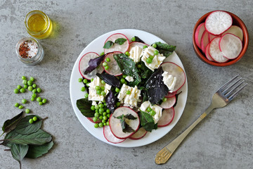 Healthy dietary salad with green peas, radish and white cheese. Keto diet. Keto Salad