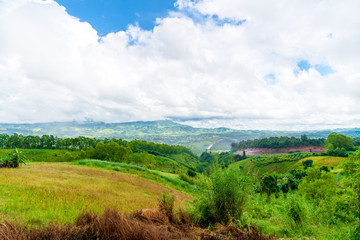 Obraz premium Blue sky high peak mountains fog hills mist scenery national park views at Phu Tub Berk, Khao Koh, Phetchabun Province, Thailand