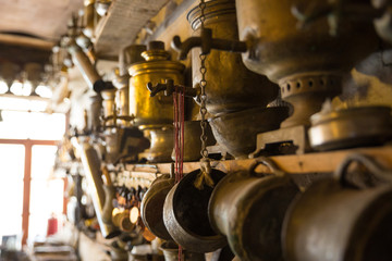 Coppersmith workshop and hand made copper things, Lahich, Azerbaijan. Interior of coppersmith workshop in the village.