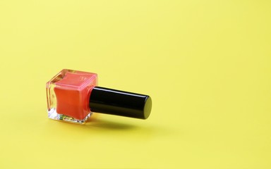 Nail polish on yellow background