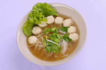 Spicy tom yum noodles with pork, thai noodles, Tom yum pork noodles soup on white background