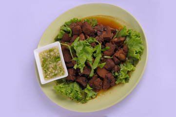Chicken braised in a sauce Adobo close-up on a plate on the table. horizontal