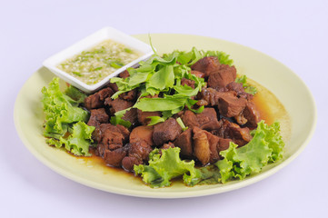 Chicken braised in a sauce Adobo close-up on a plate on the table. horizontal