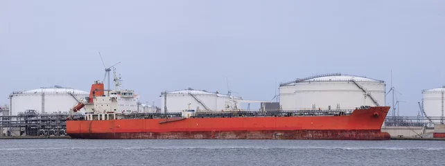 Fototapeten Moored tanker at embankment of an oil refinery,  Port of Antwerp, Belgium © tonyv3112
