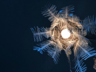 ฺBeautiful light hanging on the dark ceiling, copy space 