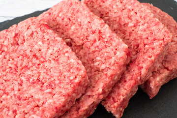 Scottish Lorne or Squared Slice Sausage on a black Slate Board.