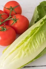 Lettuce and Tomatoes on a White Board