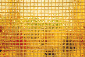 Gold mosaic tiles wall. Gold square texture background