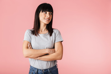 Attractive young brunette woman standing