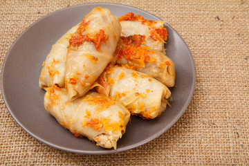 Delicious homemade cabbage rolls stuffed with rice and meat in plate
