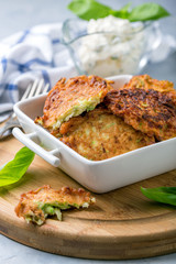 Zucchini fritters with sour cream sauce.