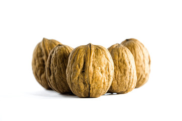 Five Walnuts on White Background