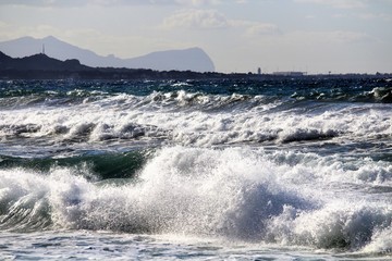 rescue boat on the beach with cape in the background
