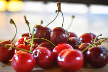 Large collection of fresh red cherries served on a table