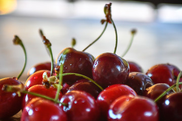 Large collection of fresh red cherries served on a table