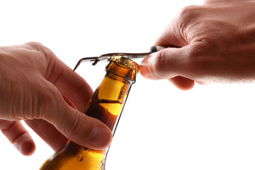 Detail of hands open a beer can with bottle opener